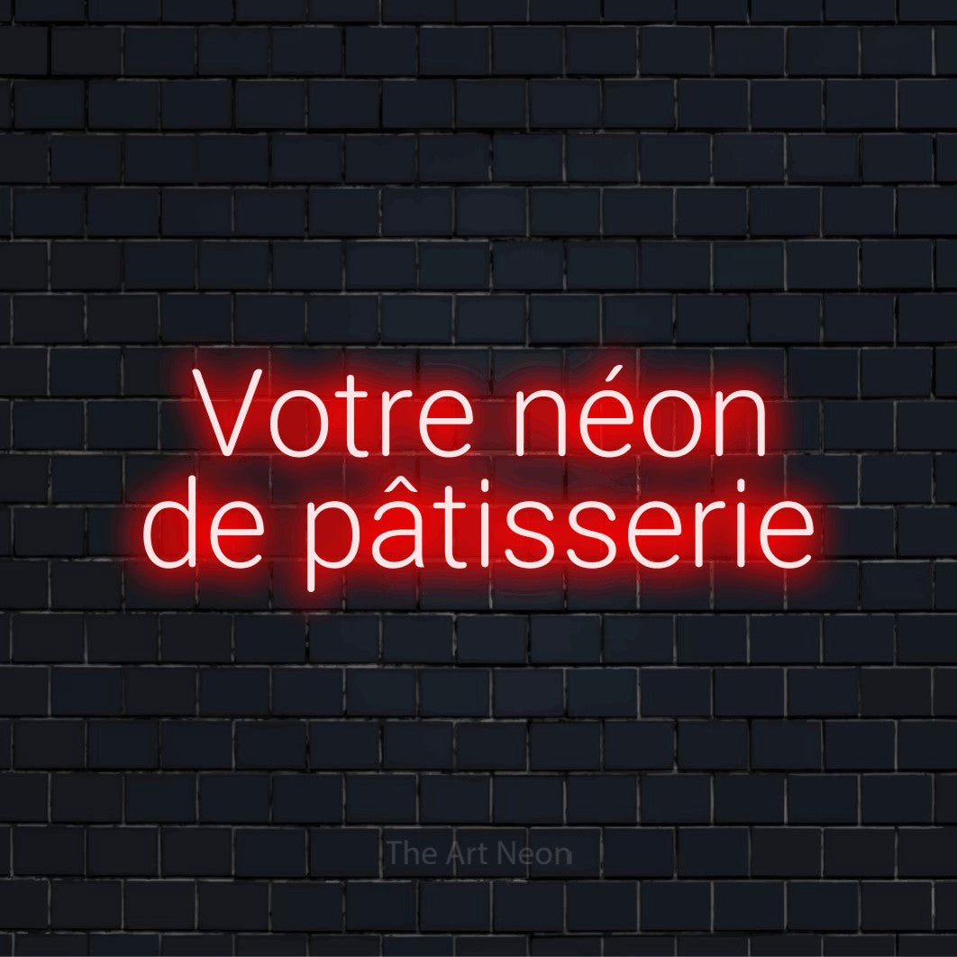 Enseigne néon personnalisée « Votre néon de pâtisserie » sur un mur en briques noires