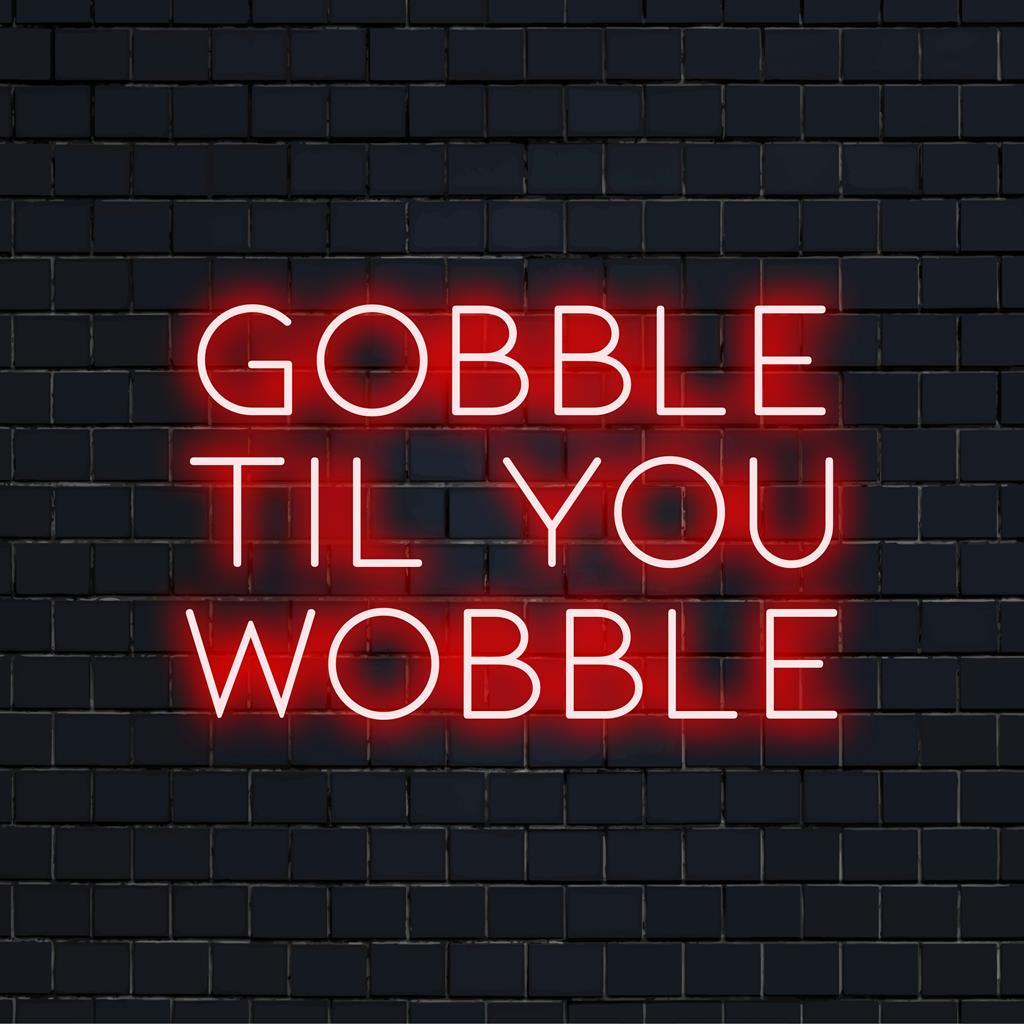 Anpassad LED neonskylt med den nyckfulla frasen Gobble Til You Wobble, perfekt för festlig neoninredning.