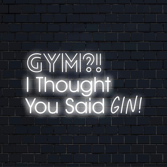 Vibrant pink and blue neon sign reading Gym? I Thought You Said Gin! adds whimsy to your decor, brimming with fun loveness.