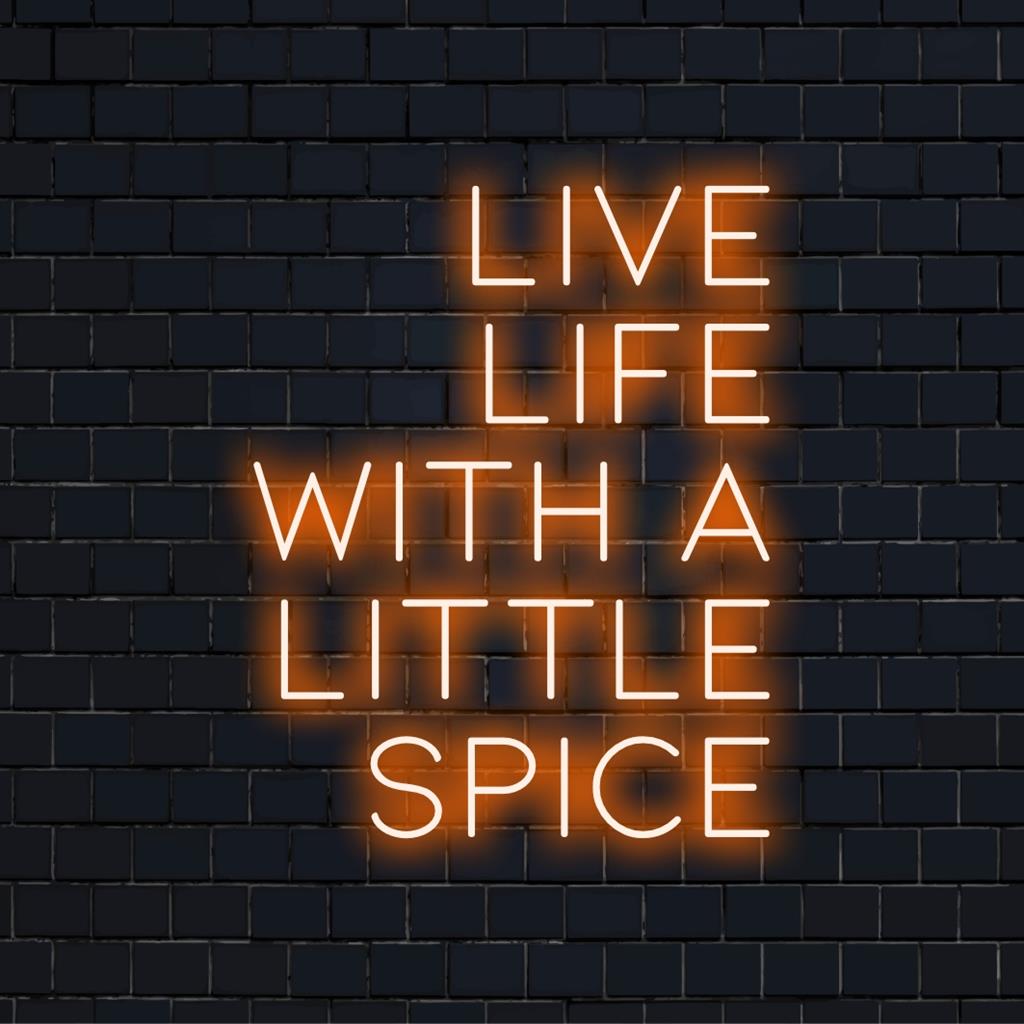Anpassad LED-neonskylt som visar Live Life With A Little Spice i livfulla färger för unik inredning eller varumärke.