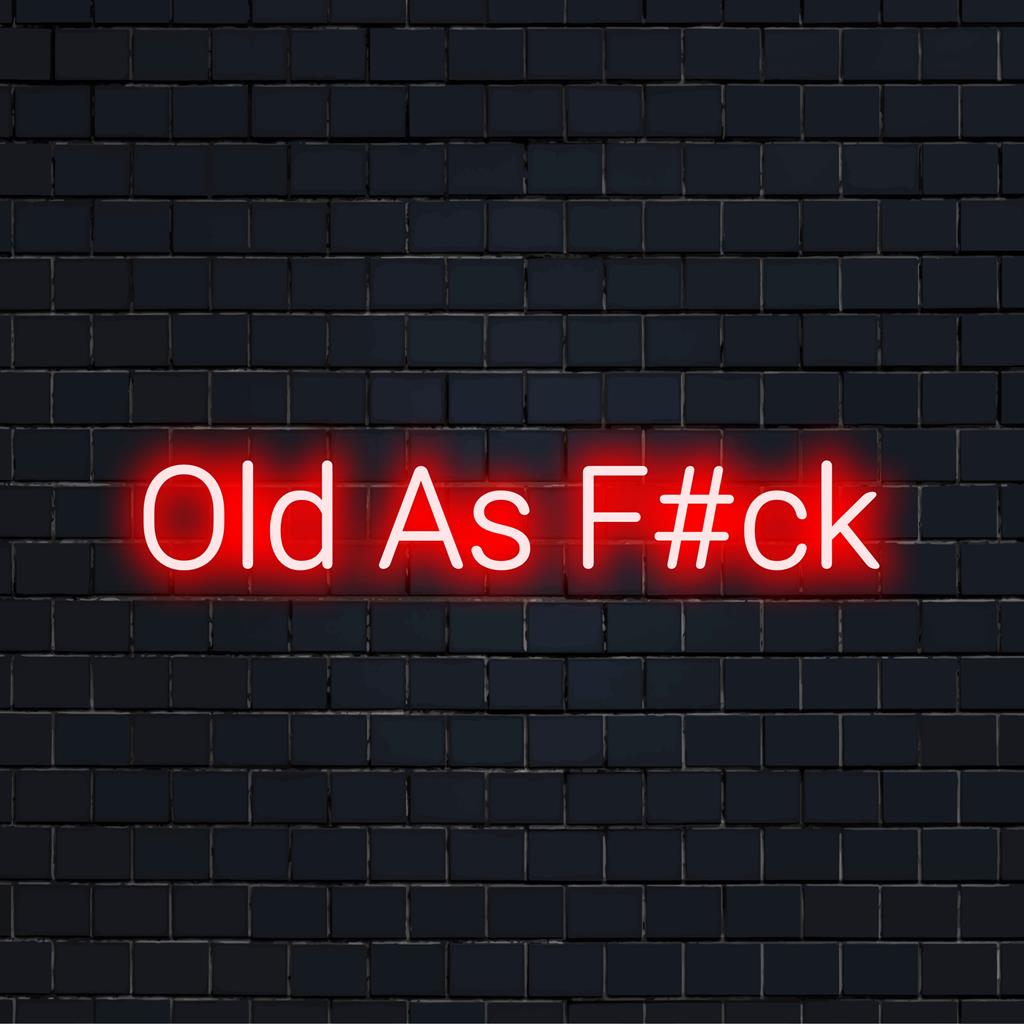 LED-neonskylt med Old As F#ck med djärva bokstäver, perfekt neonkonstverk för tuffa och roliga inredningsutrymmen.