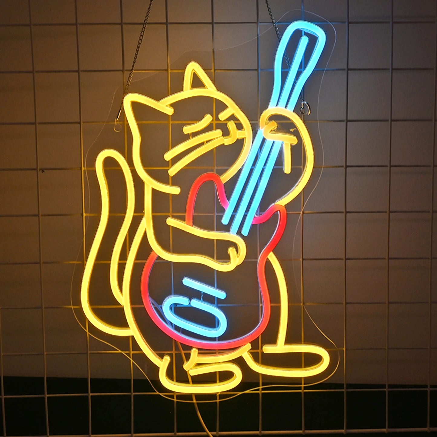 "An LED neon sign features a cartoon-style cat energetically playing an electric guitar.