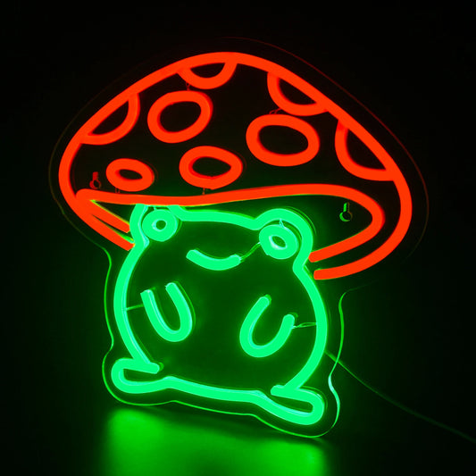 The image features a vibrant LED neon sign in the shape of a cute anime-style frog.