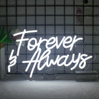 Bilden visar en snygg, handgjord LED-neonskylt som läser "Forever Always" i elegant, kursivt manus.