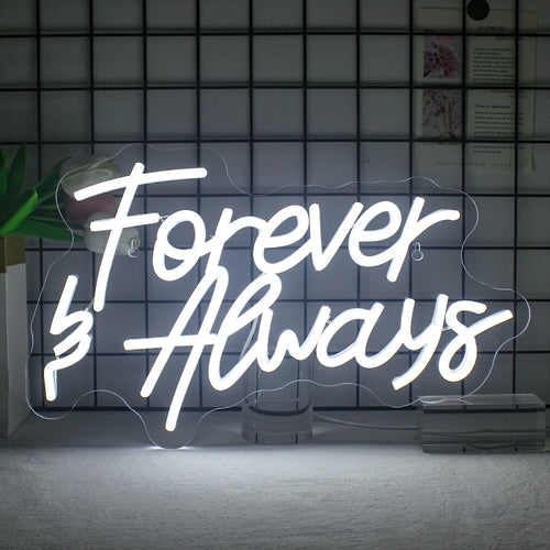Bilden visar en snygg, handgjord LED-neonskylt som läser "Forever Always" i elegant, kursivt manus.