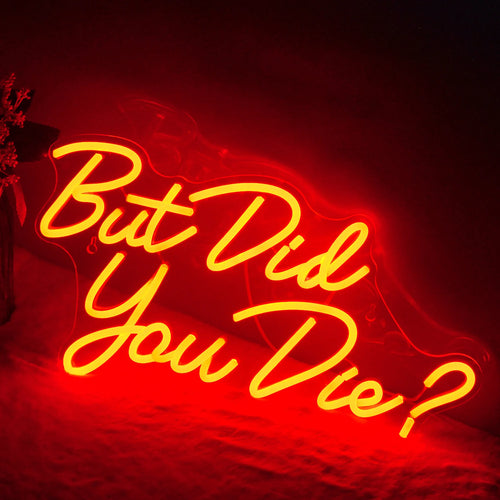 Bilden har en levande LED-neonskylt som visar frasen "But did you die" med djärva, lekfulla bokstäver.