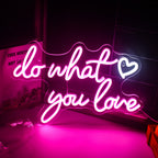 A vibrant, glowing LED neon sign displaying the phrase "Do What You Love" in a playful, cursive font.
