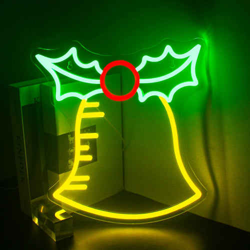 Bilden har en handgjord LED-neonskylt som visar det festliga meddelandet "Bell Merry Christmas.