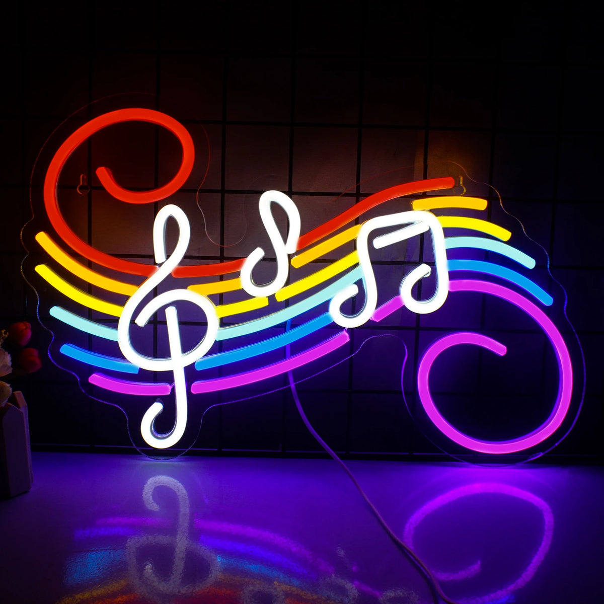 Bilden visar en levande LED-neonskylt formad som en serie musiknoter.