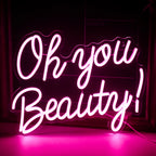 Bilden har en levande, handgjord LED-neonskylt som visar orden "Oh You Beauty.