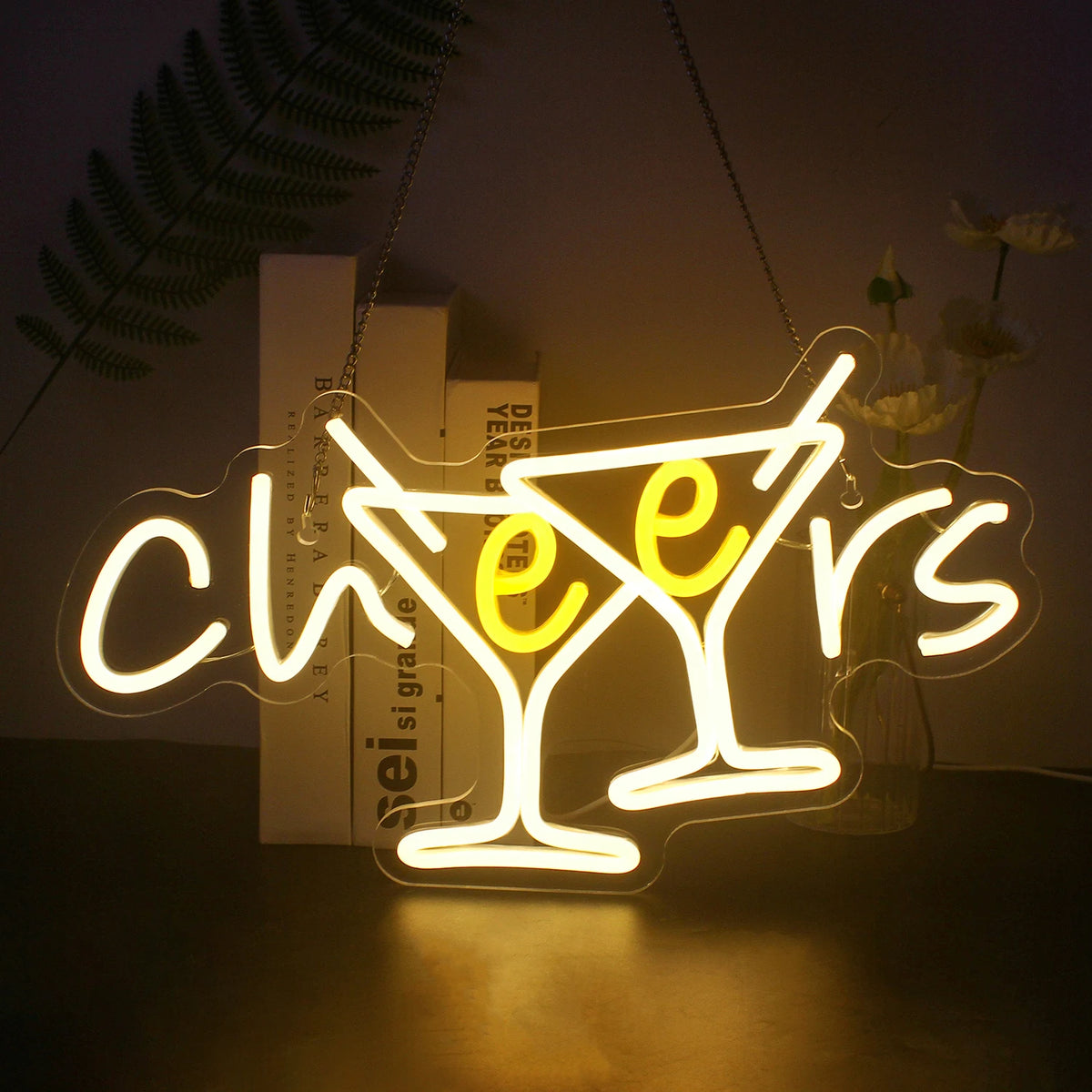 "En livlig LED-neonskylt som visar ordet "Cheers" i ett lekfullt kursivt teckensnitt.