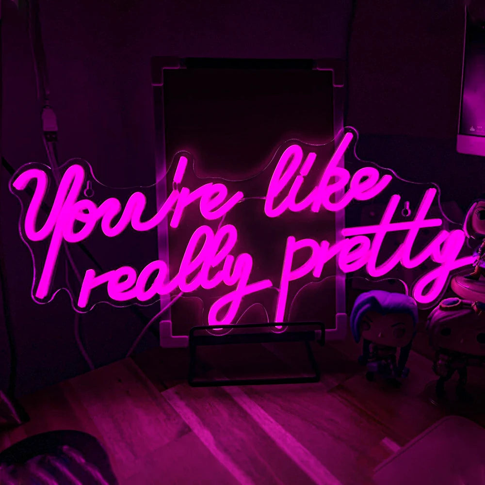 "En skräddarsydd LED-neonskylt som visar frasen "You're Like Really Pretty" i snygg, kursiv handstil.
