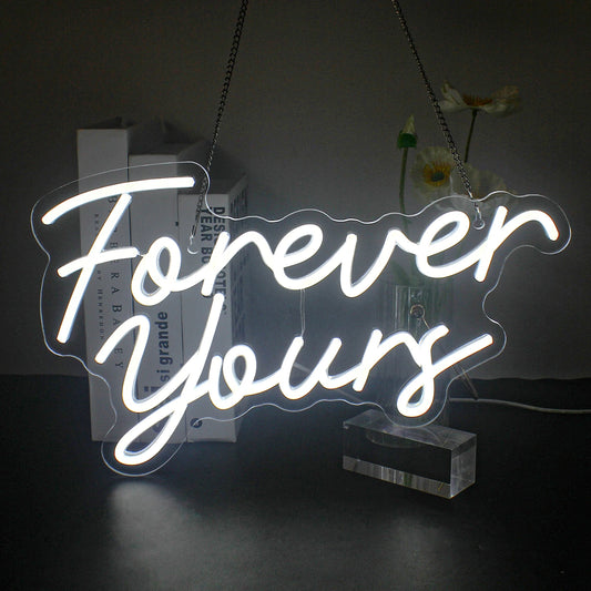 A vibrant LED neon sign displaying the phrase "Forever Yours" in elegant cursive lettering.