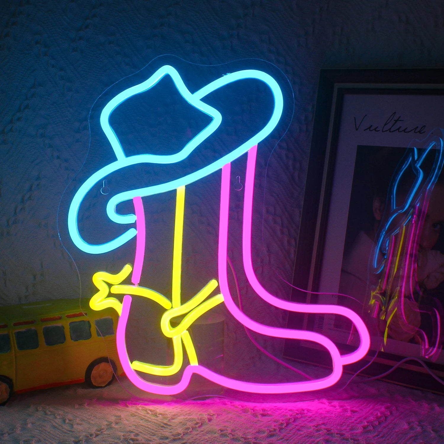 The image features a Cowboy Boot LED Neon Sign, showcasing a vibrant, glowing outline of a classic cowboy boot.