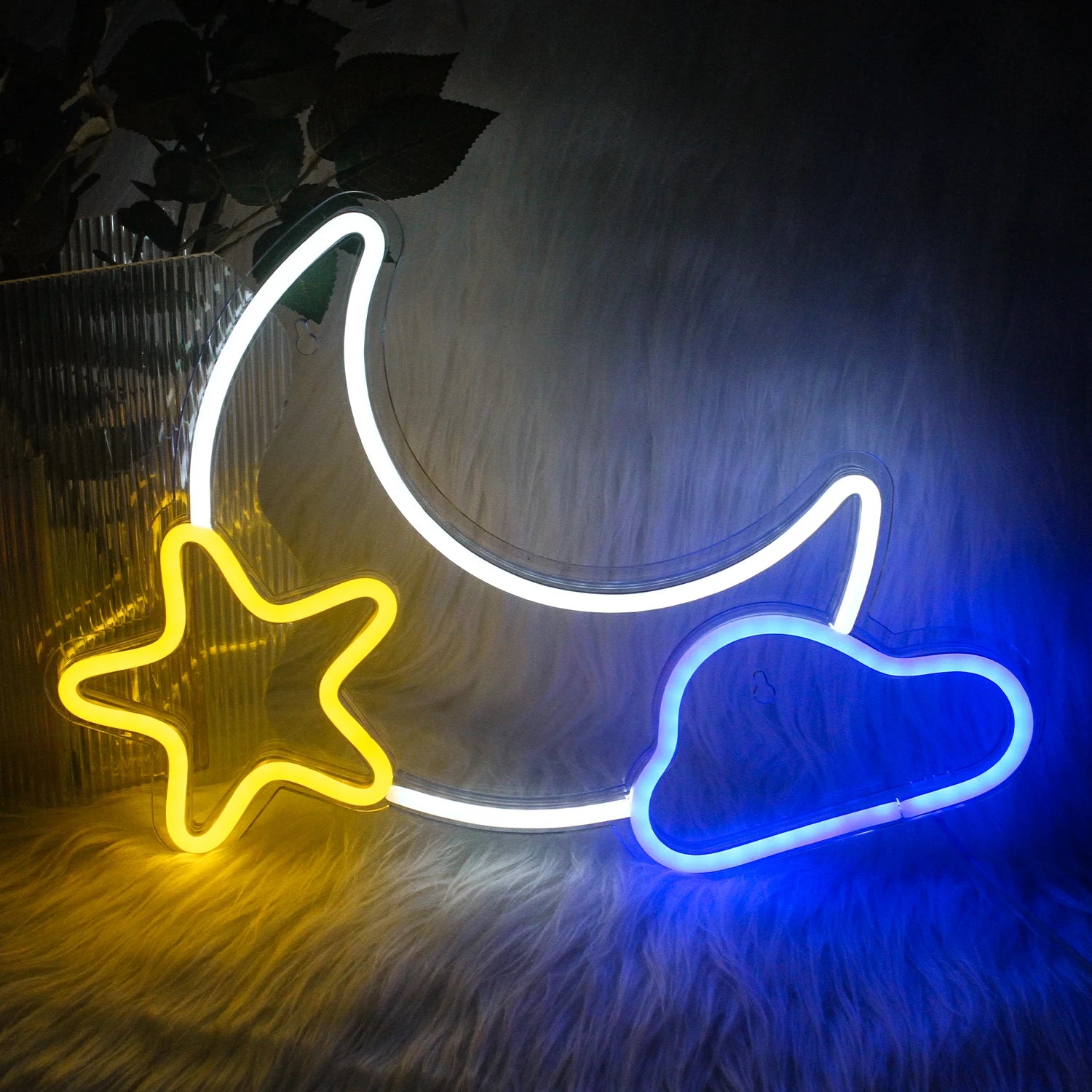 The image displays a charming LED neon sign depicting a crescent moon intertwined with a star.