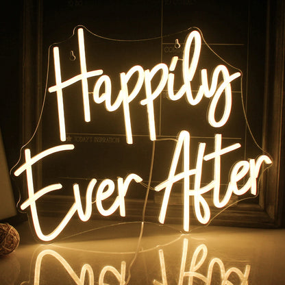The image showcases a beautifully crafted LED neon sign that spells out "Happily Ever After" in a flowing, cursive script.