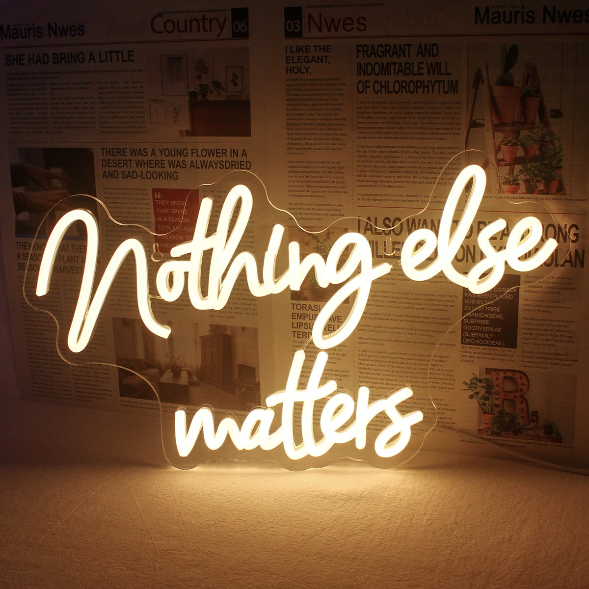 En livligt glödande LED-neonskylt som visar frasen "Nothing Else Matters" i ett elegant, kursivt teckensnitt.