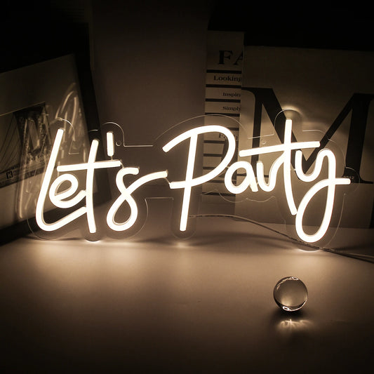 A vibrant "Let's Party" LED Neon Sign is displayed, featuring bold, cursive lettering.
