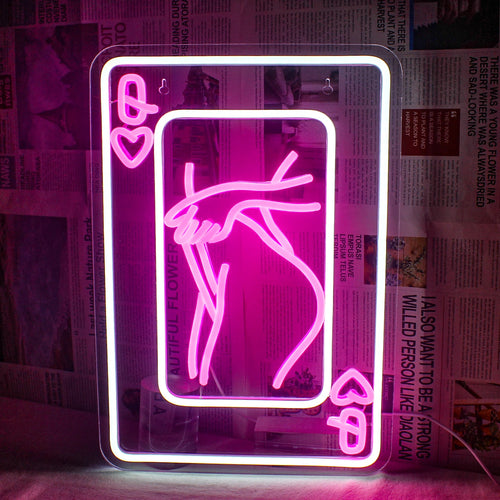 The image features an LED neon sign depicting a stylized representation of a woman composed of playing card elements.