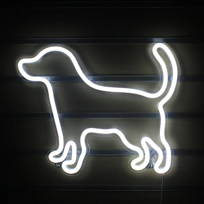 A vibrant LED neon sign shaped like a small, playful dog.
