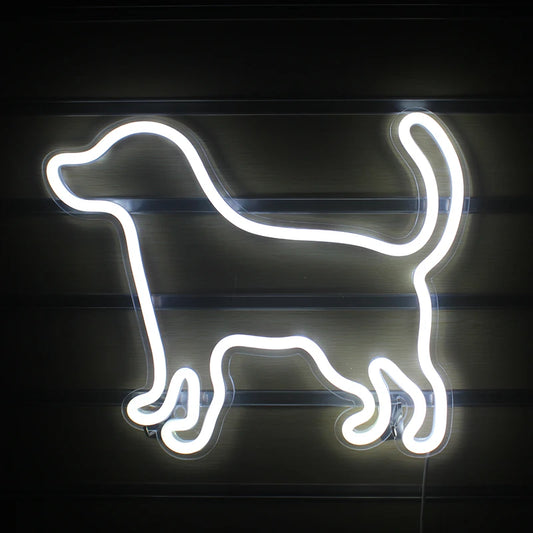 A vibrant LED neon sign shaped like a small, playful dog.