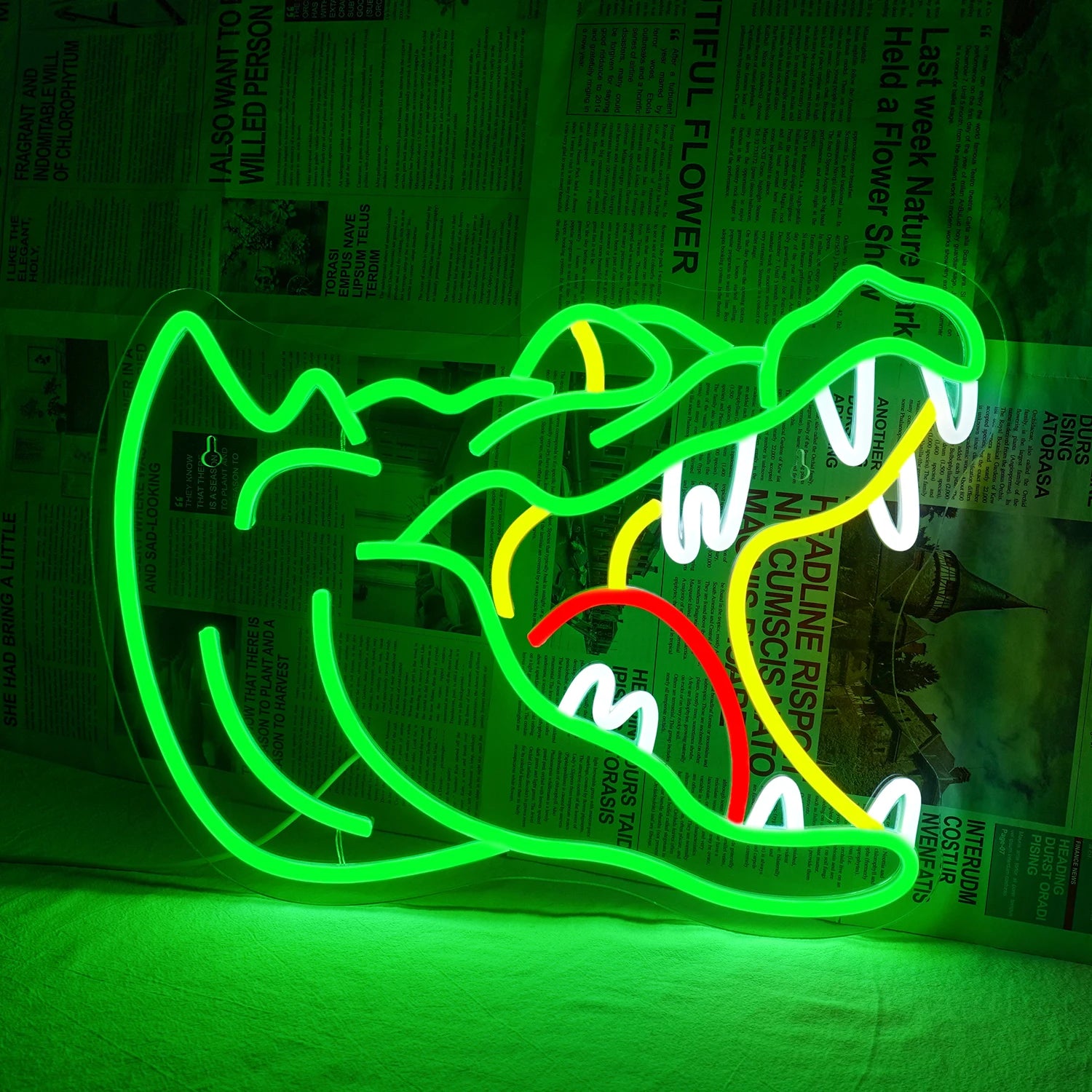 Bilden har en levande LED-neonskylt formad som en alligator.