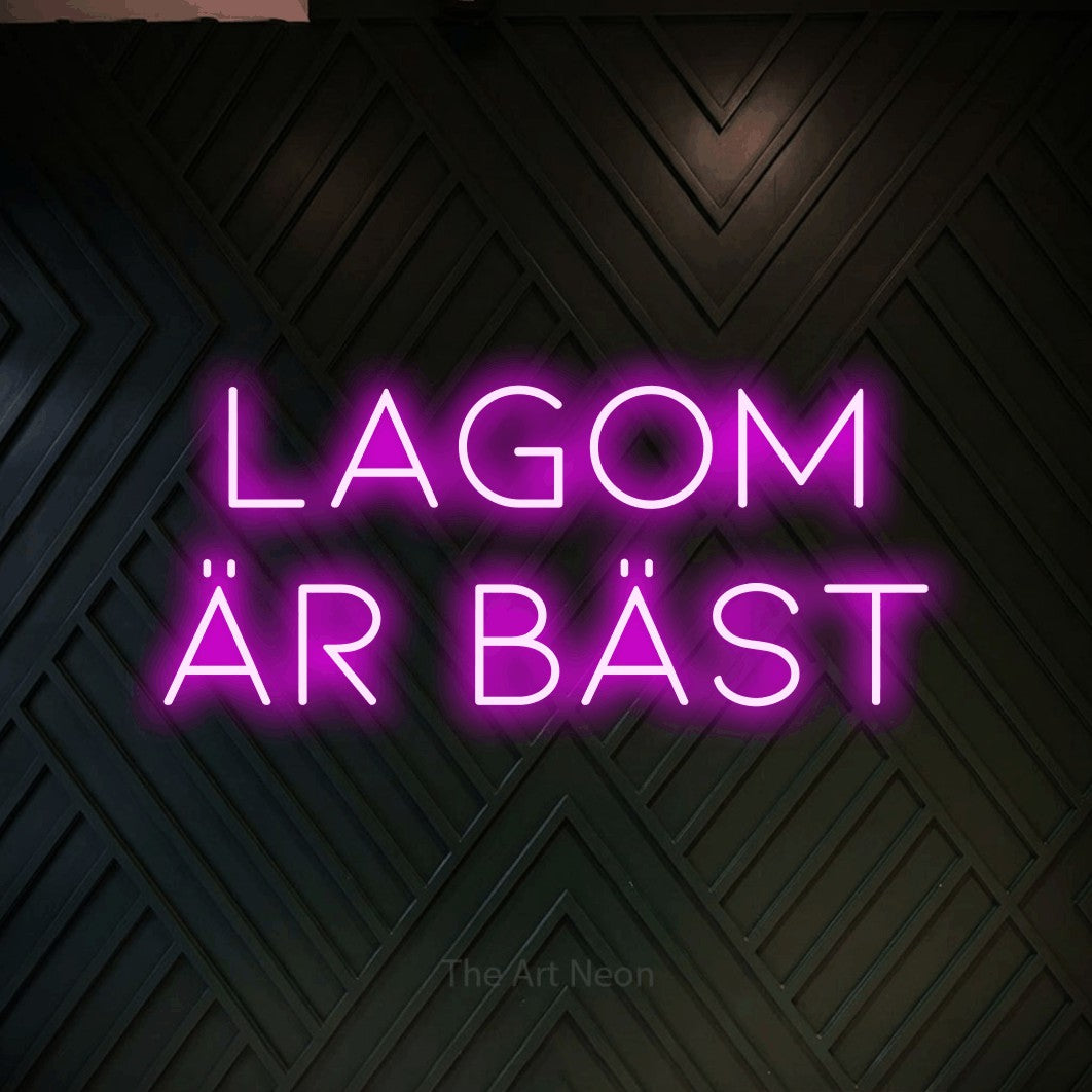 LED neon sign reading “Lagom Är Bäst”, arranged in 2 lines.