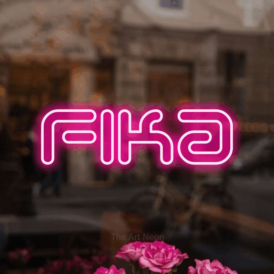 LED neon sign reading “Fika”, arranged in a single line.
