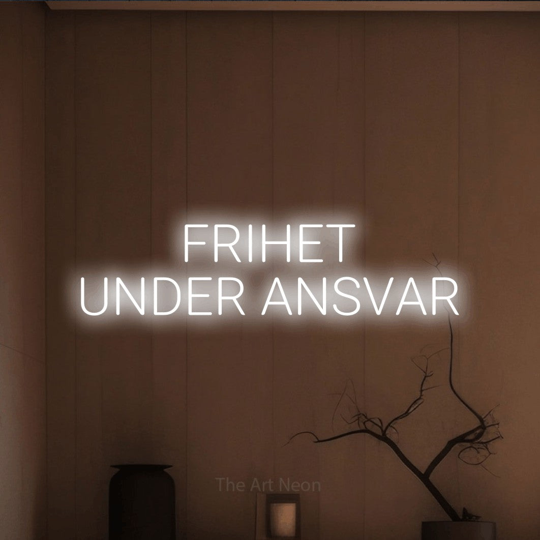 LED neon sign reading “FRIHET UNDER ANSVAR”, arranged in 2 lines.