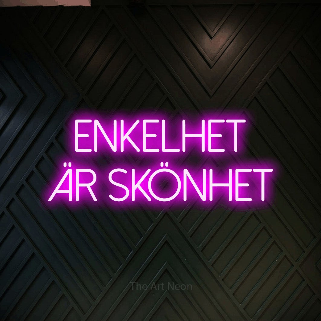 LED neon sign reading “ENKELHET ÄR SKÖNHET”, arranged in 2 lines.