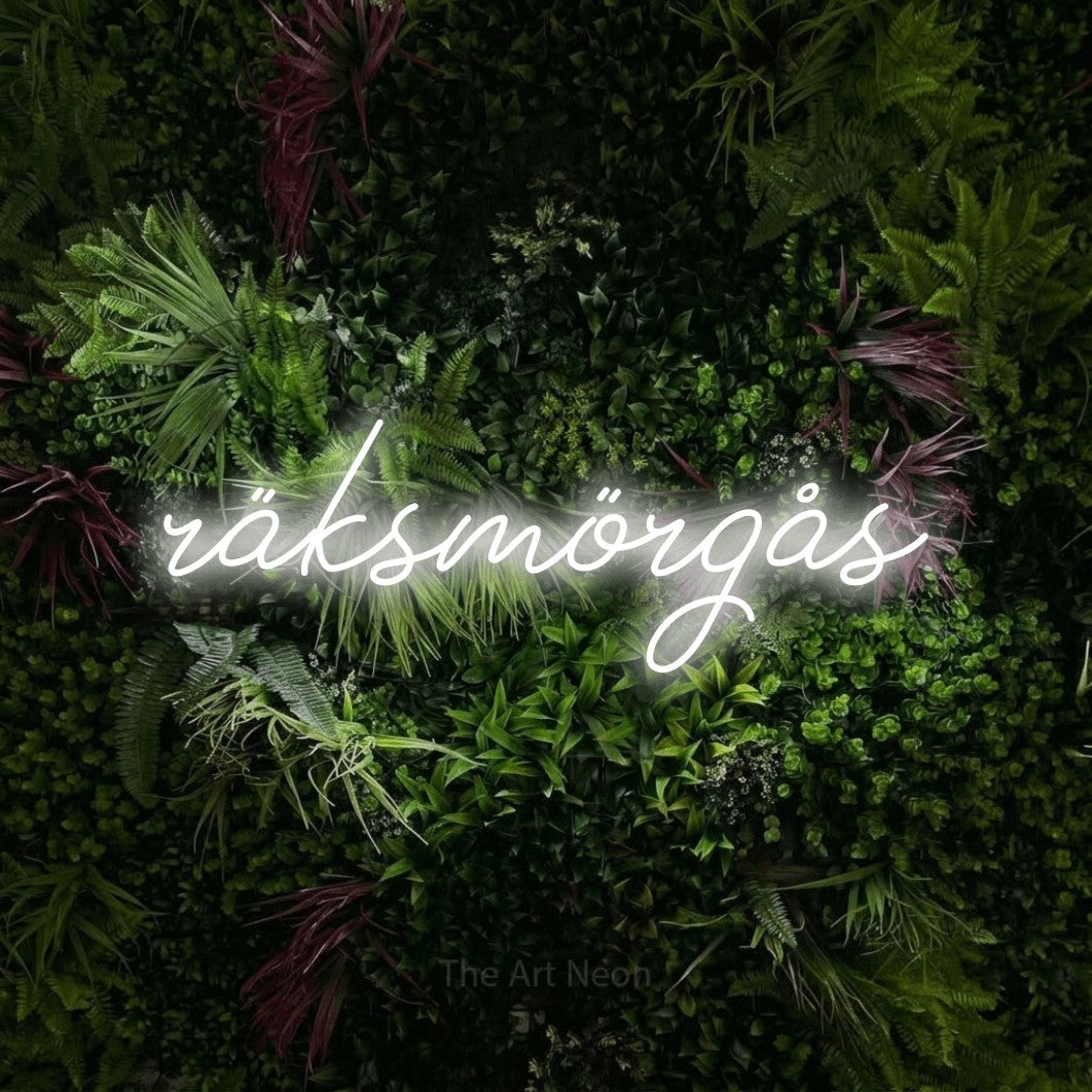 LED neon sign reading “räksmörgås”, arranged in a single line.
