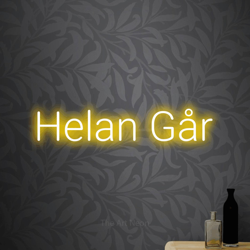 LED neon sign reading “Helan Går”, arranged in a single line.