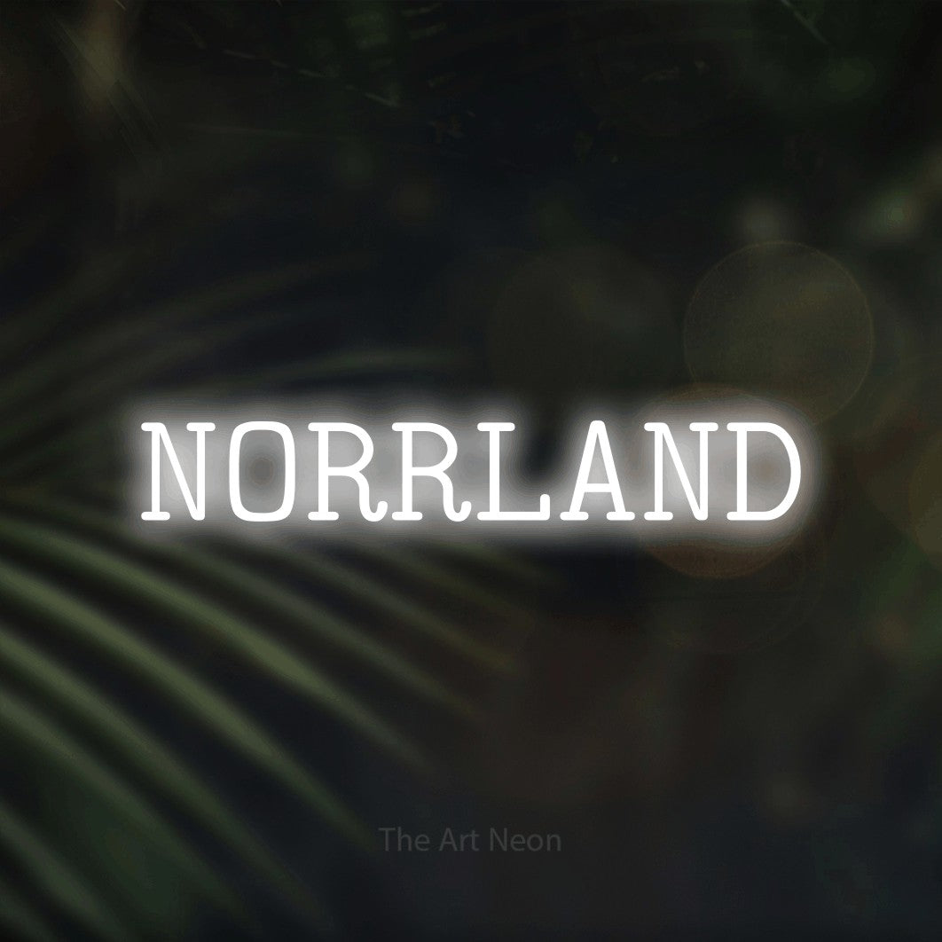 LED neon sign reading “NORRLAND”, arranged in a single line.