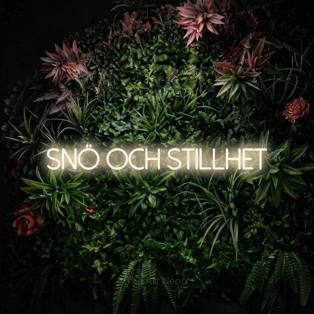 LED neon sign reading “Snö Och Stillhet”, arranged in a single line.
