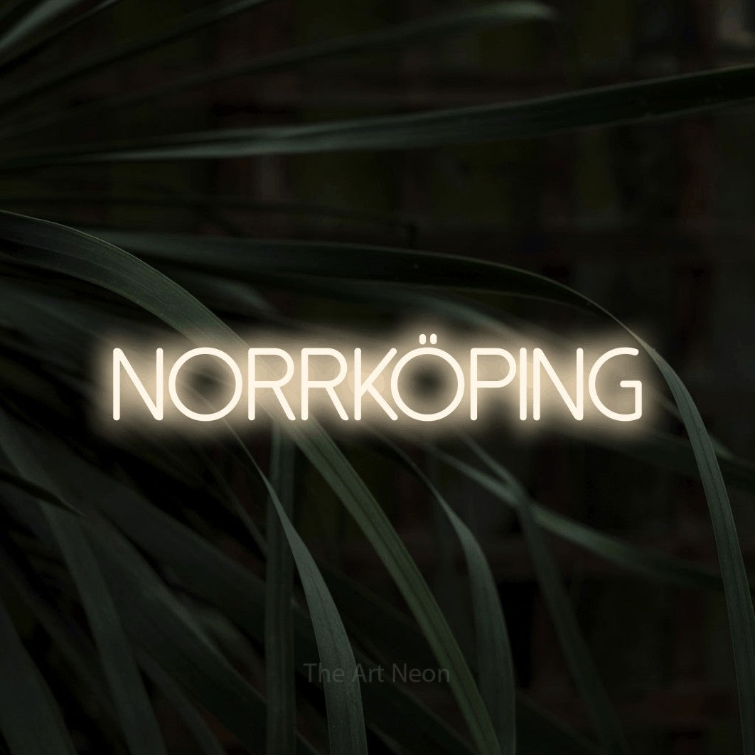 LED neon sign reading “norrköping”, arranged in a single line.