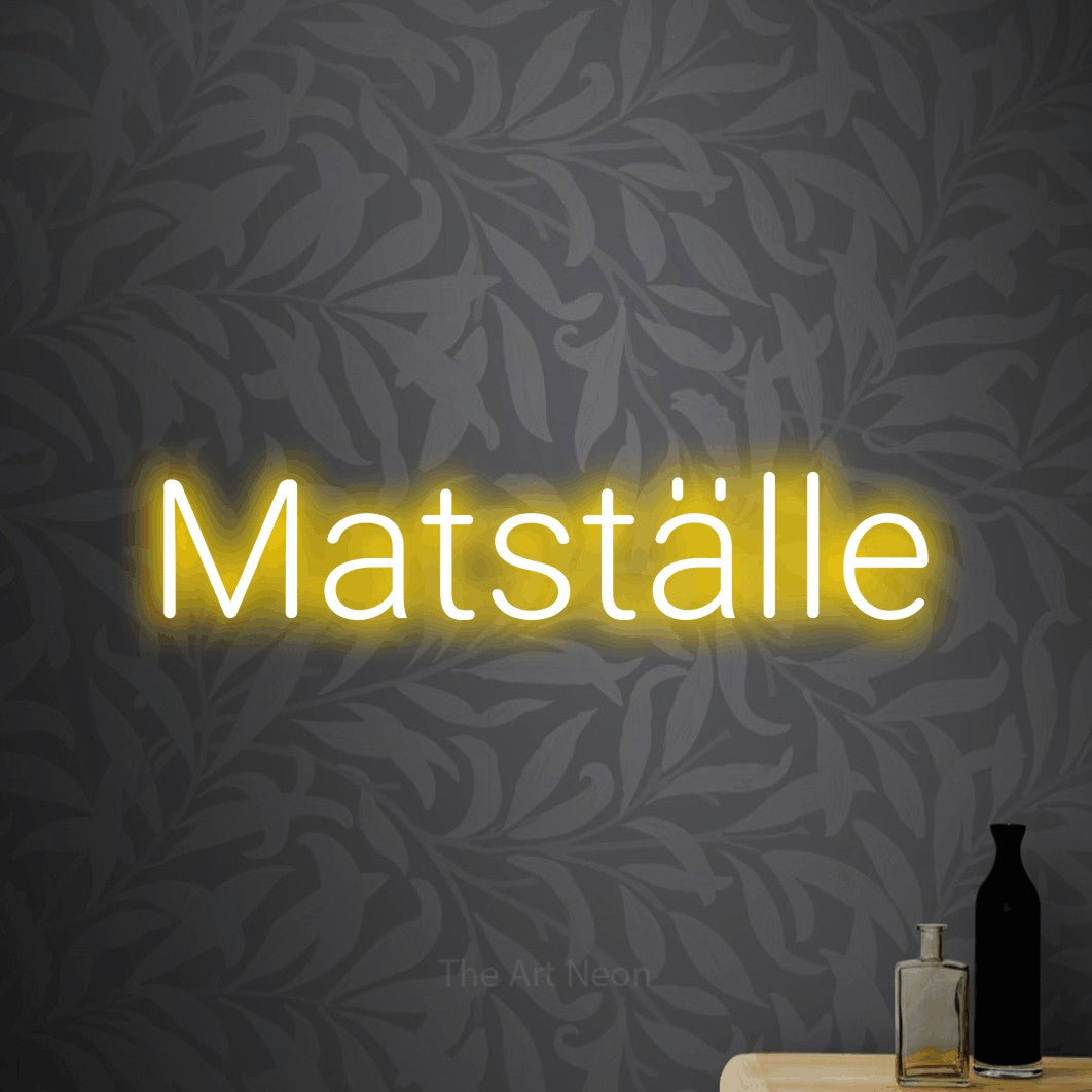 LED neon sign reading “Matställe”, arranged in a single line.