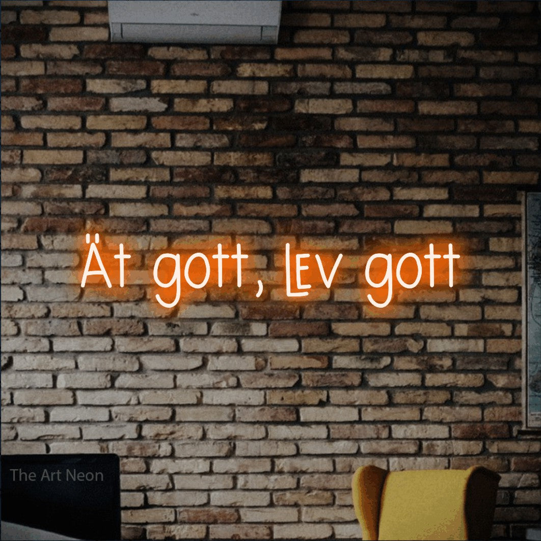 LED neon sign reading “Ät gott, lev gott”, arranged in a single line.