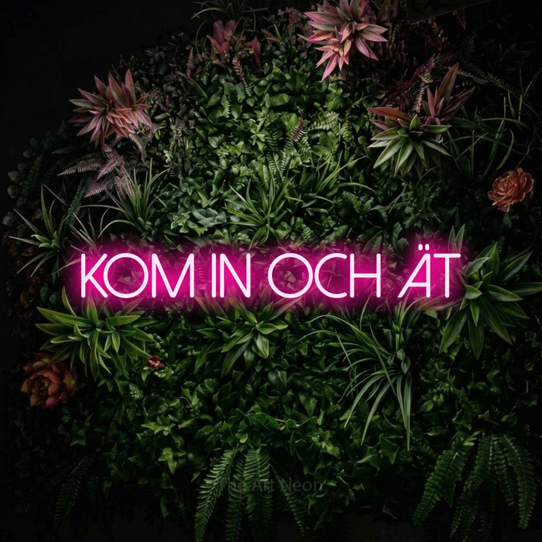 LED neon sign reading “kom in och ät”, arranged in a single line.