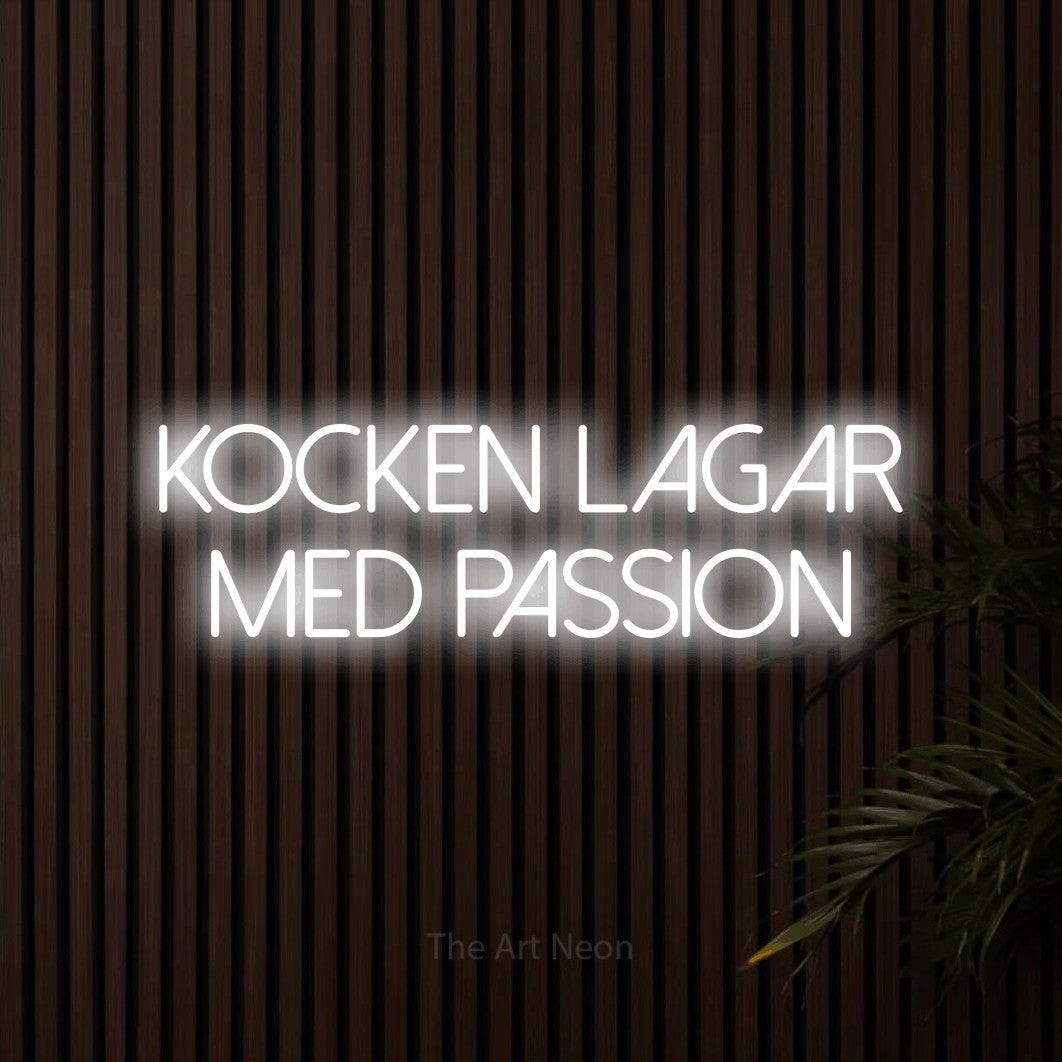 LED neon sign reading “KOCKEN LAGAR MED PASSION”, arranged in 2 lines.