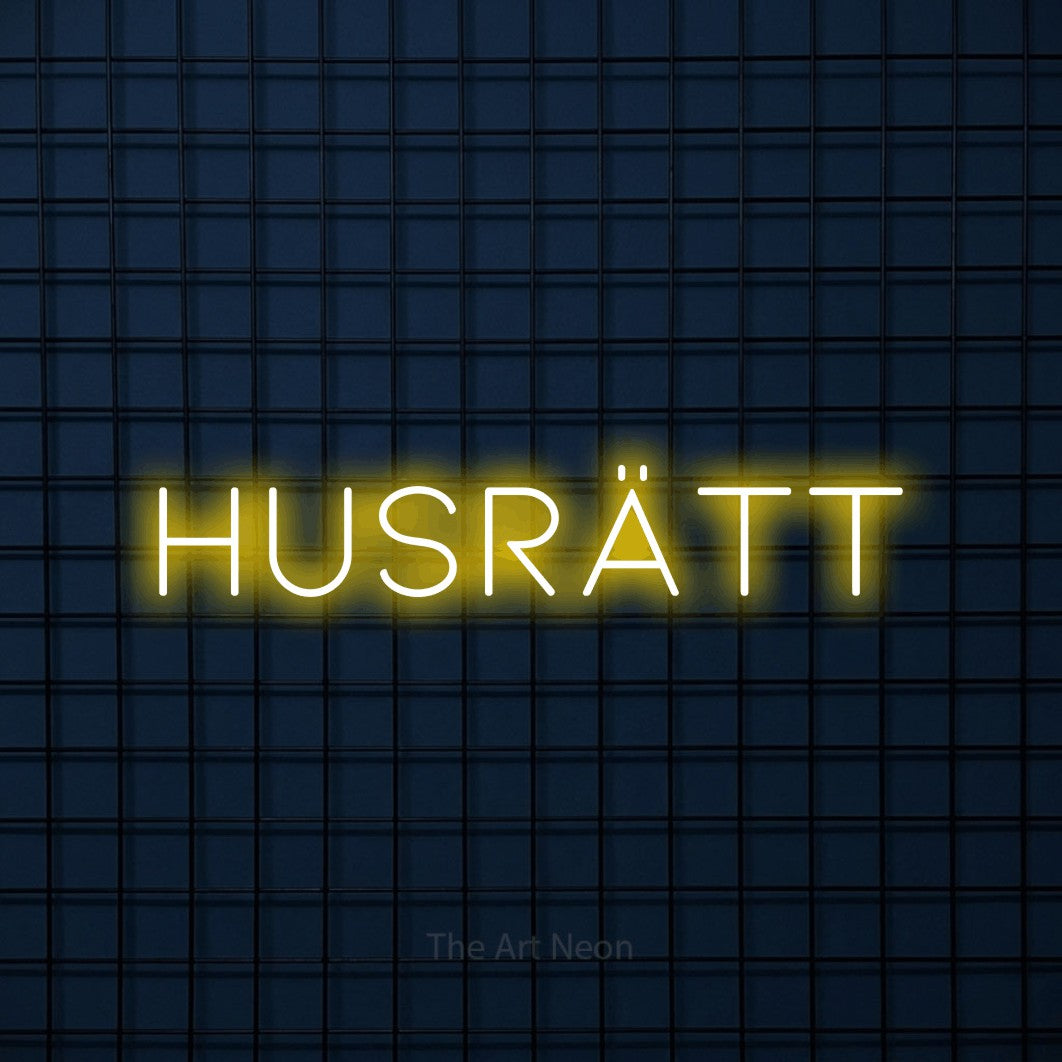 LED neon sign reading “HUSRÄTT”, arranged in a single line.