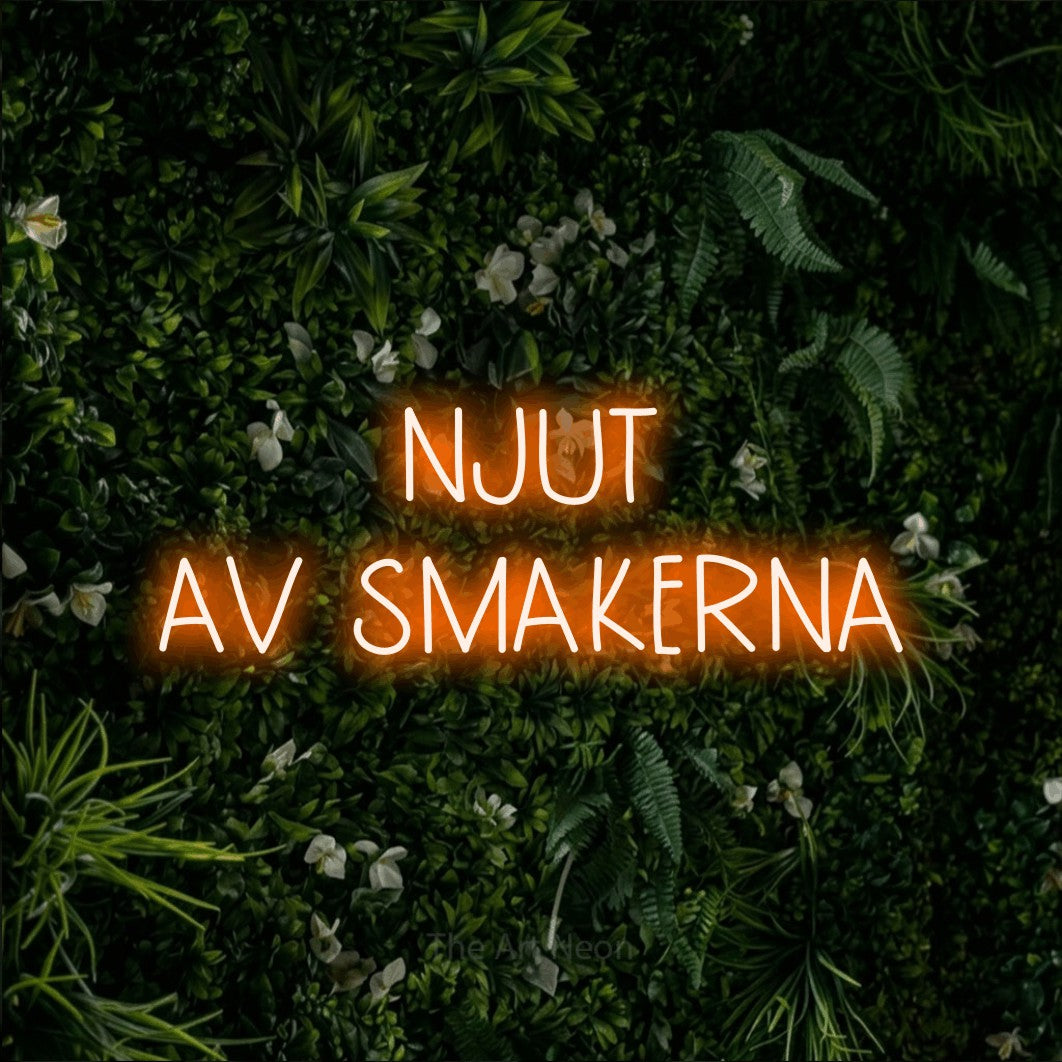 LED neon sign reading “NJUT AV SMAKERNA”, arranged in 2 lines.