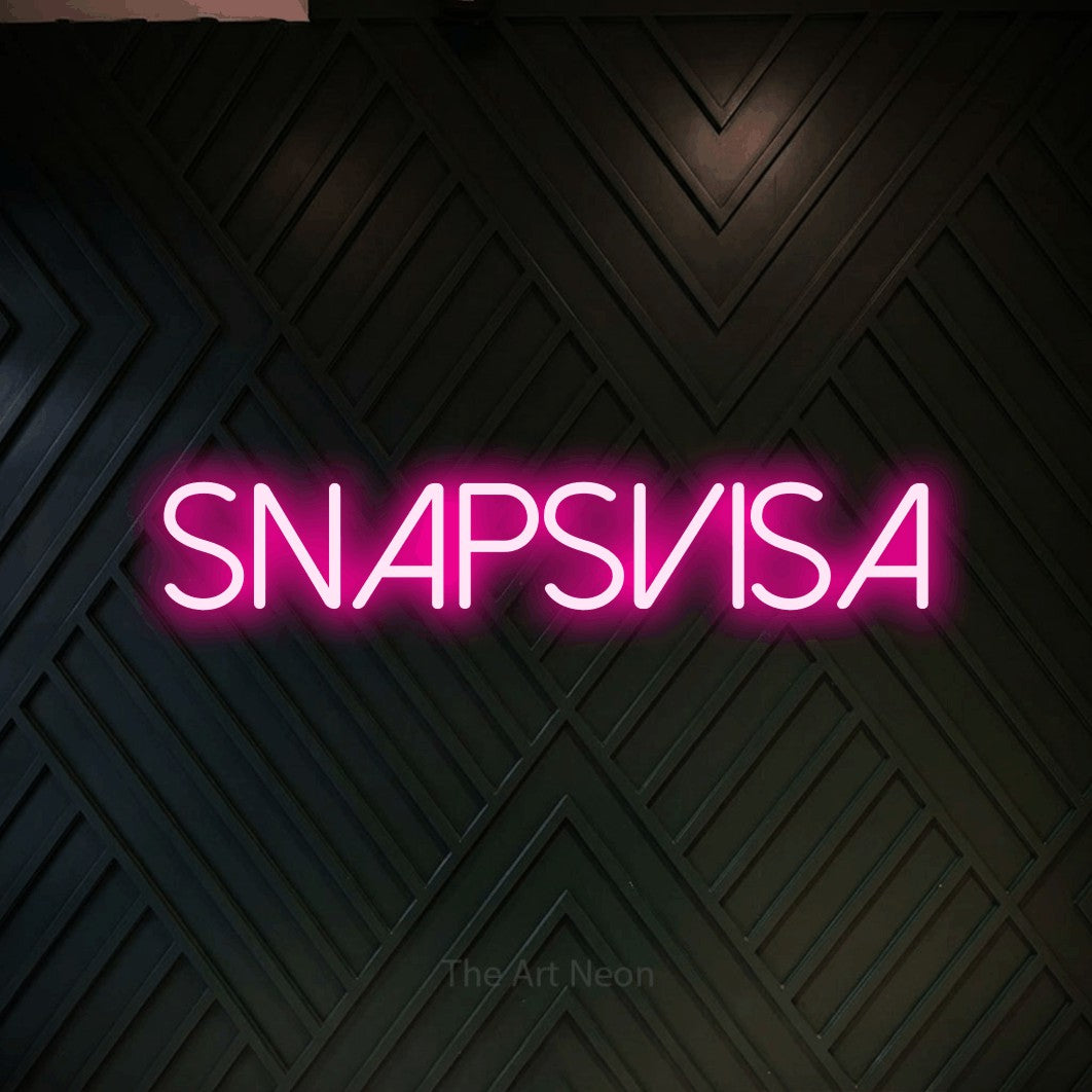 LED neon sign reading “SNAPSVISA”, arranged in a single line.