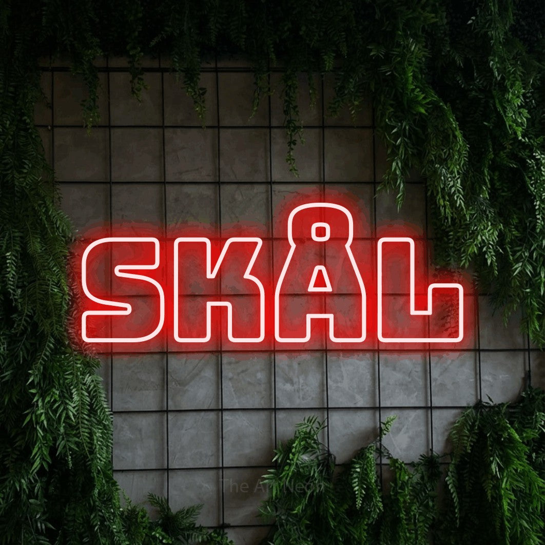 LED neon sign reading “skål”, arranged in a single line.
