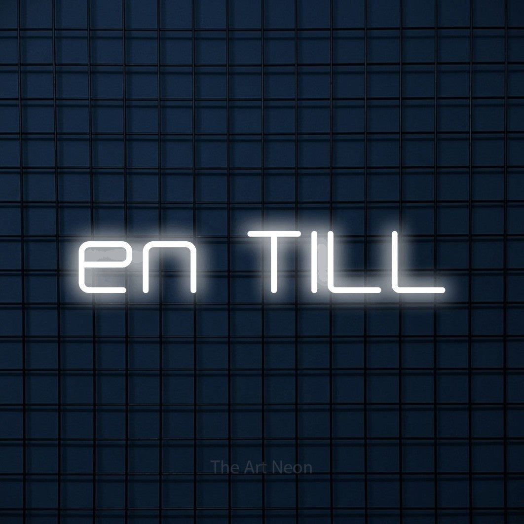 LED neon sign reading “en TILL”, arranged in a single line.