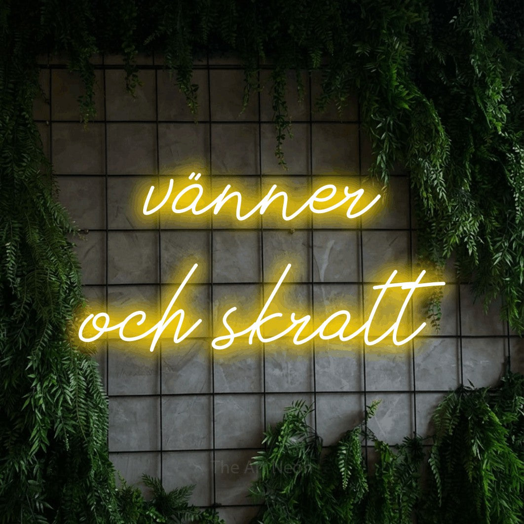 LED neon sign reading “vänner och skratt”, arranged in 2 lines.
