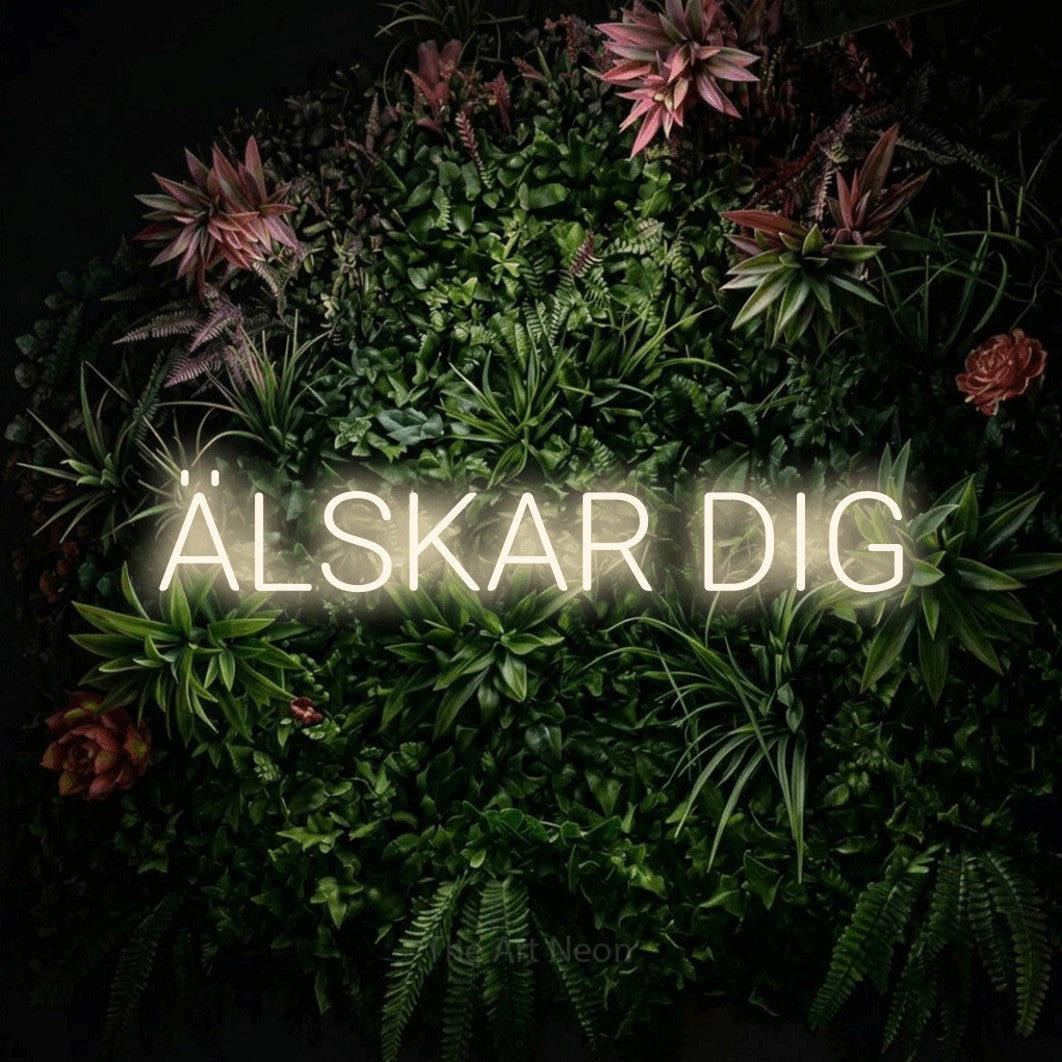 LED neon sign reading “ÄLSKAR DIG”, arranged in a single line.