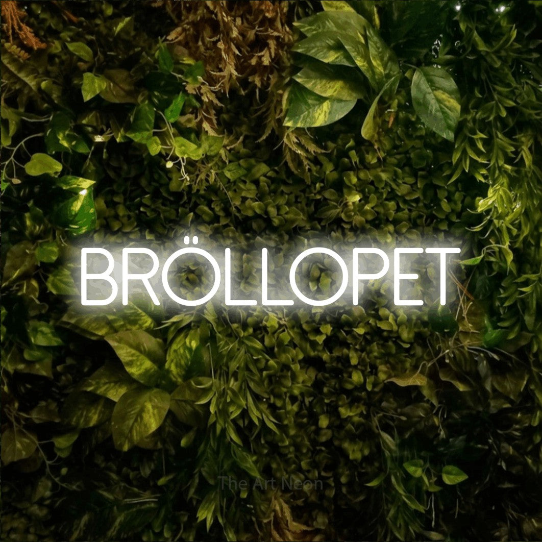 LED neon sign reading “BRÖLLOPET”, arranged in a single line.