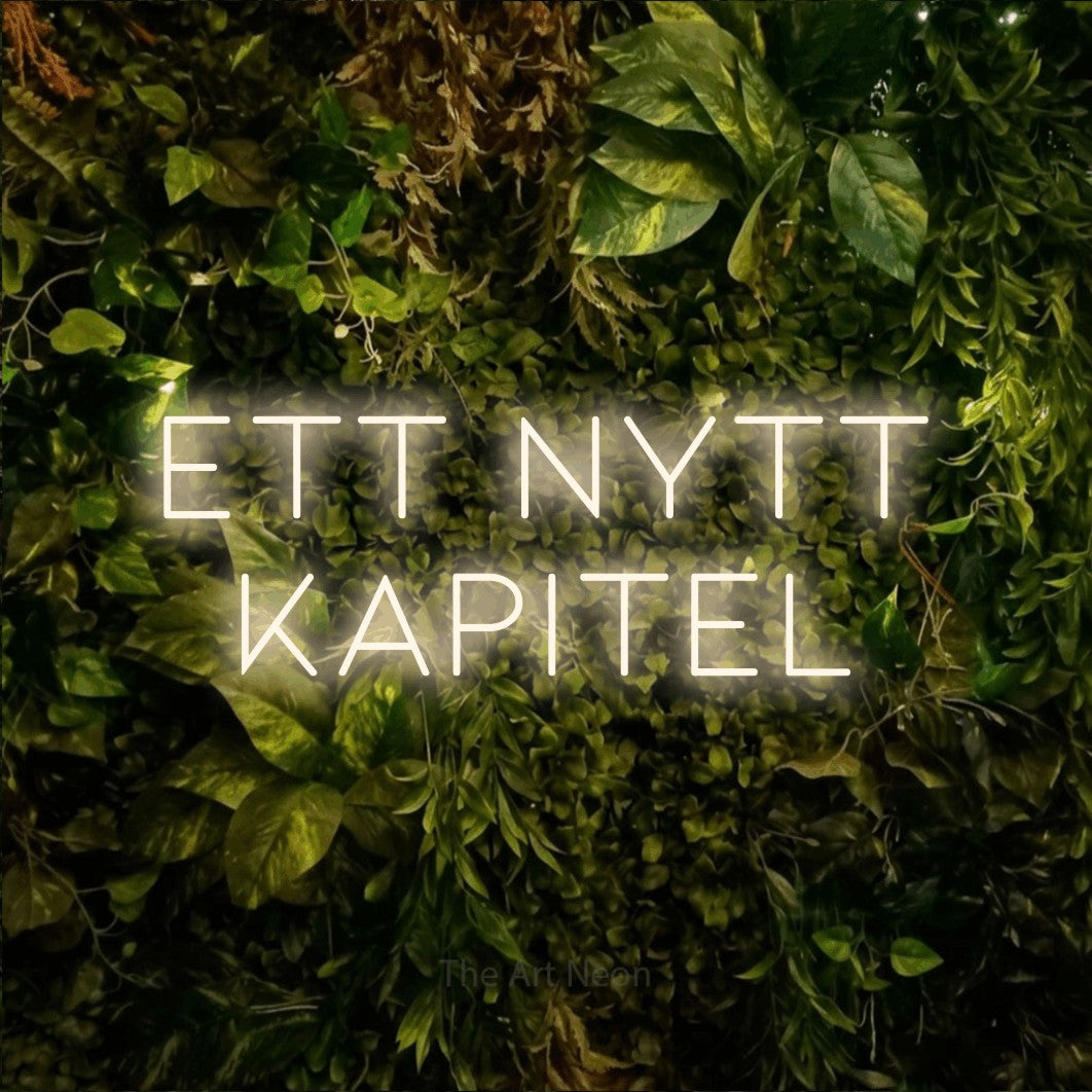 LED neon sign reading “ett nytt kapitel”, arranged in 2 lines.