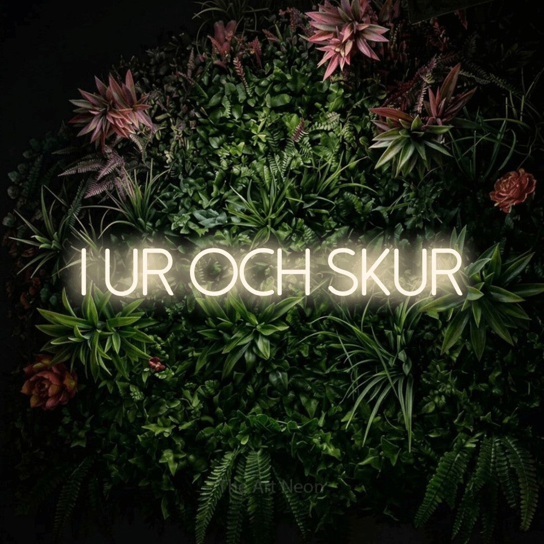 LED neon sign reading “i ur och skur”, arranged in a single line.