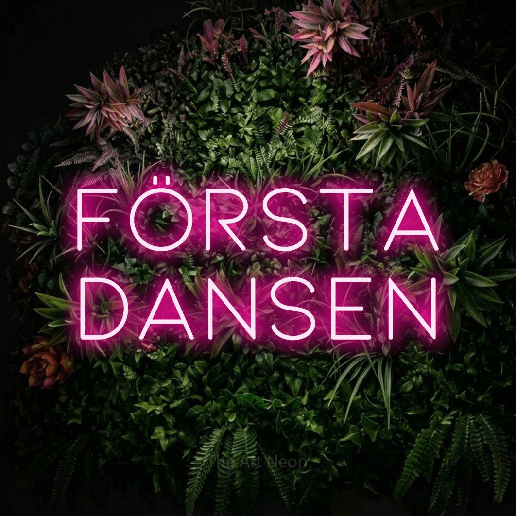 LED neon sign reading “första dansen”, arranged in 2 lines.